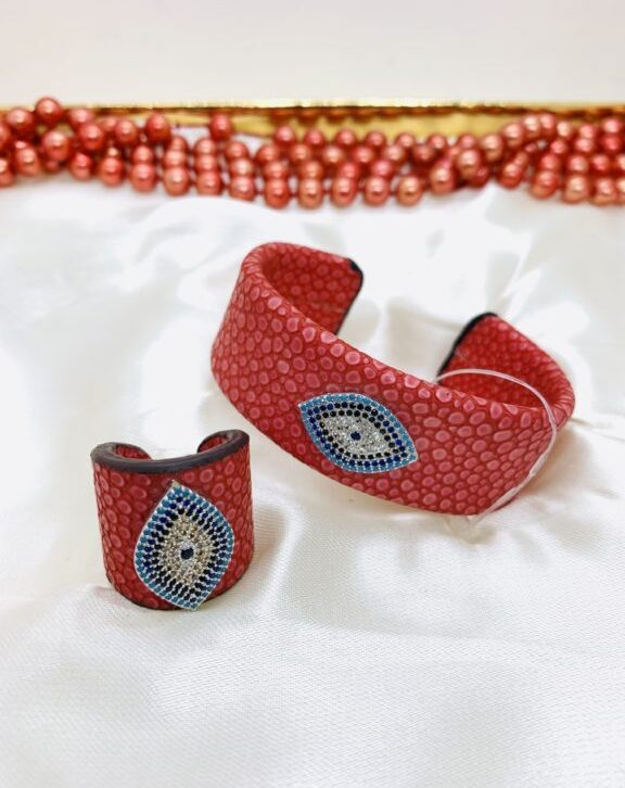 Red Bracelet With Finger Ring Studded with turkey stones.